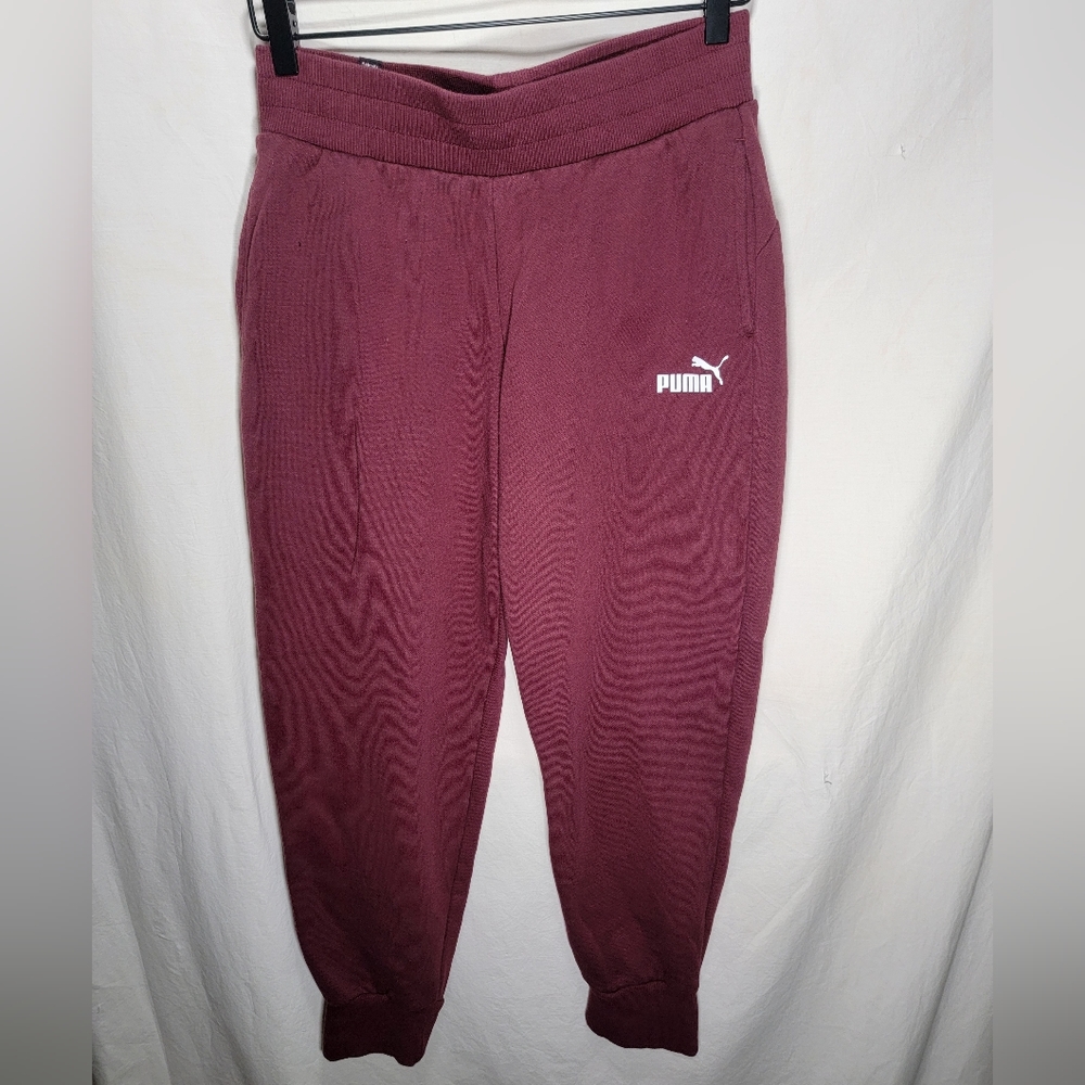 Burgundy colored size small Puma joggers with cuffed ankles in great condition.